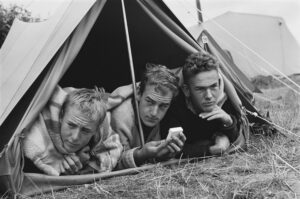 Three campers in tent listening to the weather reports August 21, 1963