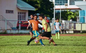 kids playing soccer at summer camp