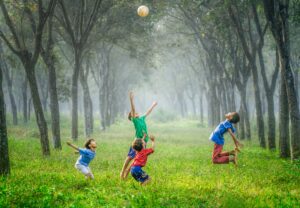 kids throwing ball at summer camp