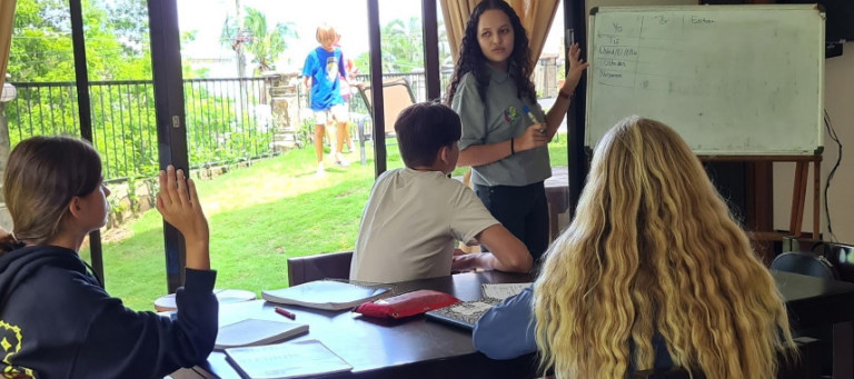 Kids learning Spanish at summer camp, with instructor by whiteboard. Fun educational activities in a lively outdoor setting. Kids learning Spanish at summer camp, with instructor by whiteboard. Fun educational activities in a lively outdoor setting.