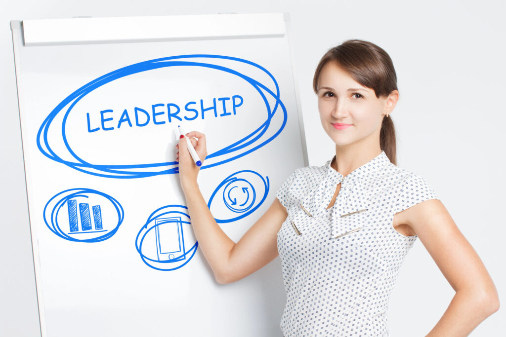 Leader teaching at summer camp workshop, promoting skills and confidence.