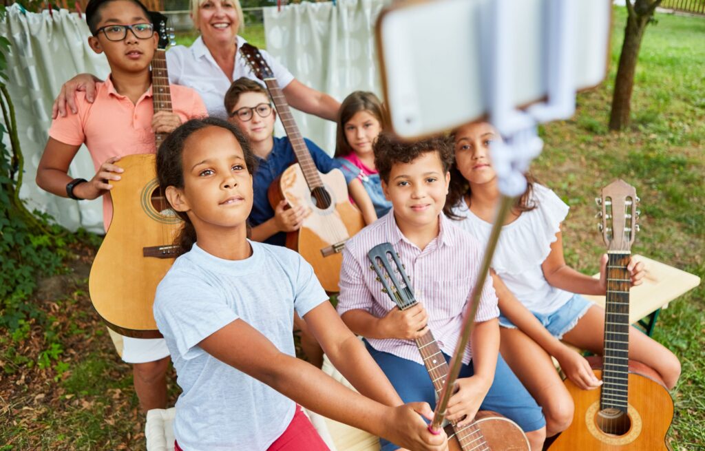 summer camp (3) Children's music band at summer camp makes a selfie for the talent show