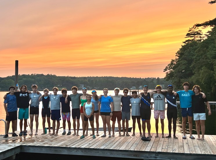 Group of teens on a dock during sunset at summer camp, enjoying outdoor activities by the lake. Group of teens on a dock during sunset at summer camp, enjoying outdoor activities by the lake.