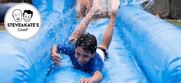 Child enjoying slip and slide at Steve & Kate's Camp, perfect summer fun for kids at our directory-listed camps. Child enjoying slip and slide at Steve & Kate's Camp, perfect summer fun for kids at our directory-listed camps.