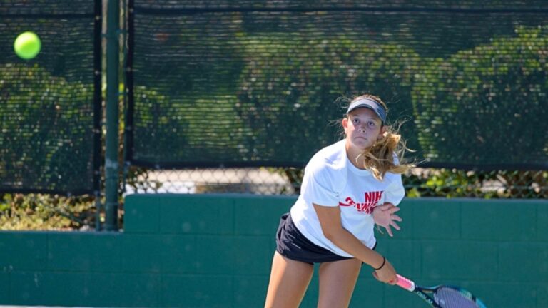 Teen girl playing tennis at summer camp, serves ball on sunny outdoor court. Teen girl playing tennis at summer camp, serves ball on sunny outdoor court.