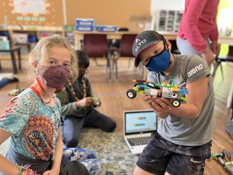 Kids building robots at summer camp, engaging in creative STEM activities. Ideal for fun learning and exploration. Kids building robots at summer camp, engaging in creative STEM activities. Ideal for fun learning and exploration.