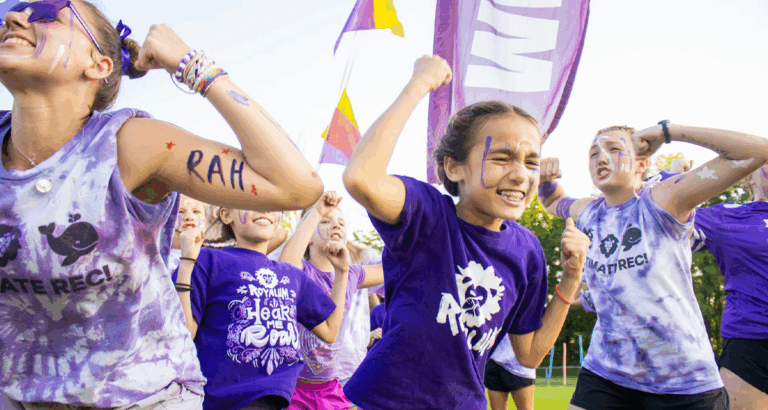 Kids celebrating at summer camp with painted faces and purple shirts. Fun and adventure in the camp directory! Kids celebrating at summer camp with painted faces and purple shirts. Fun and adventure in the camp directory!