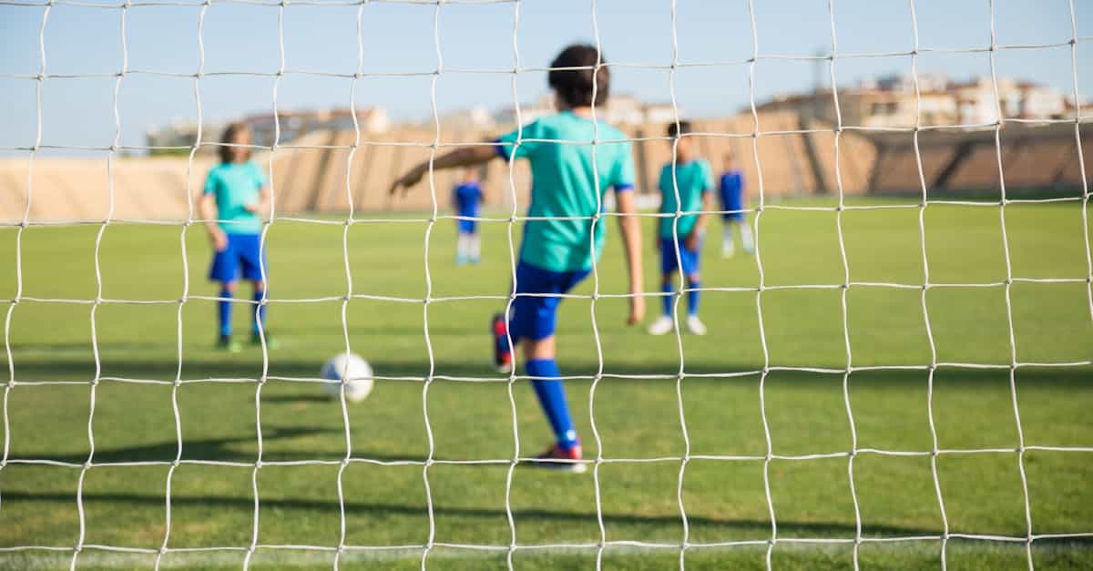 Kids playing soccer at summer camp, focusing on teamwork and fun. Perfect activity for active campers.
